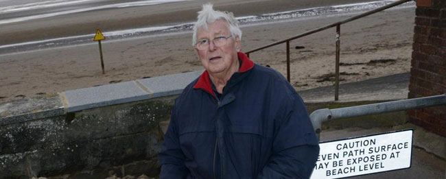 Man who lives next to a sandy beach complains about sand