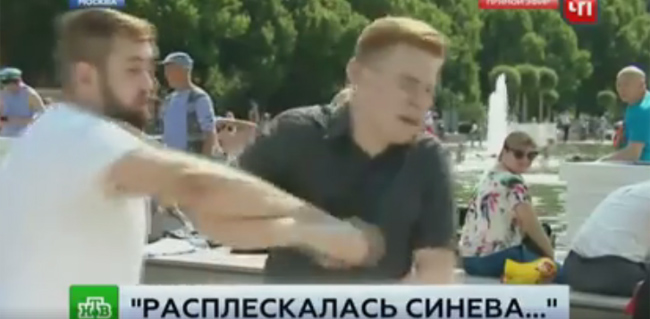 Watch as a drunken Russian nutter punches a TV correspondent in the face